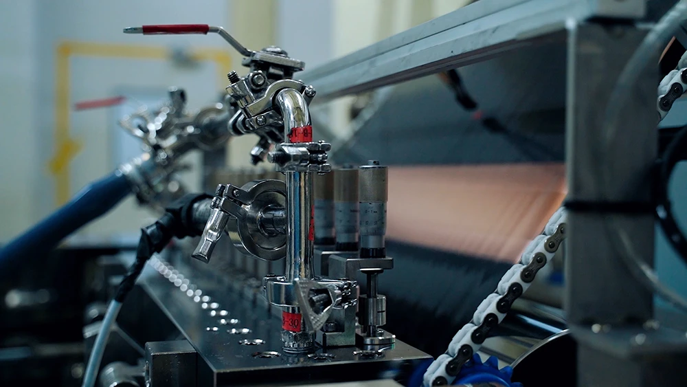 High-precision slot-die battery electrode coating machine applying uniform wet slurry onto metal foil in battery production line