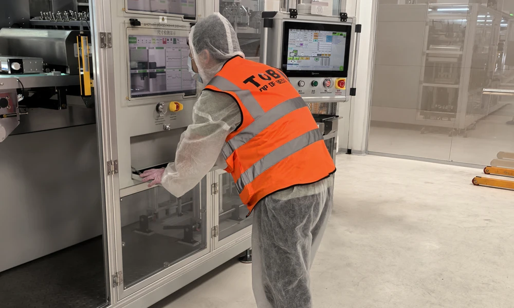 On-site service engineers are inspecting the electrode die-cutting machine