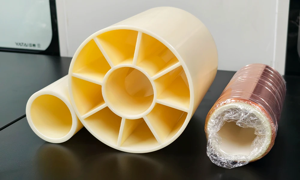 Winding cores and a copper foil roll side by side, showing the cross section of the roll